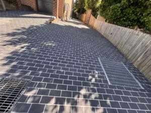 black limestone cobbles - Blue Pearl Concrete Resurfacing